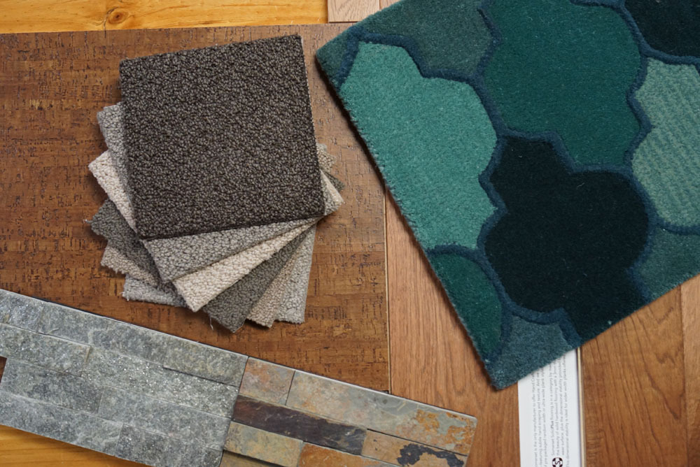 A selection of nylon carpet samples and decorative tiles on display